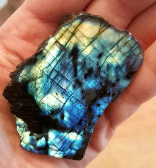 Comparison of labradorite pieces showing color intensity variations