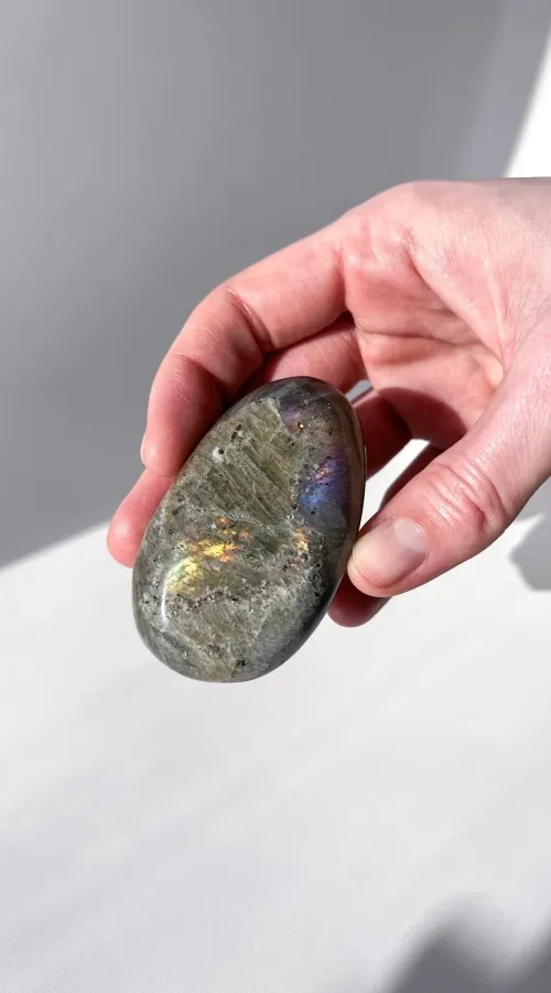 Comparison showing natural vs enhanced labradorite color patterns