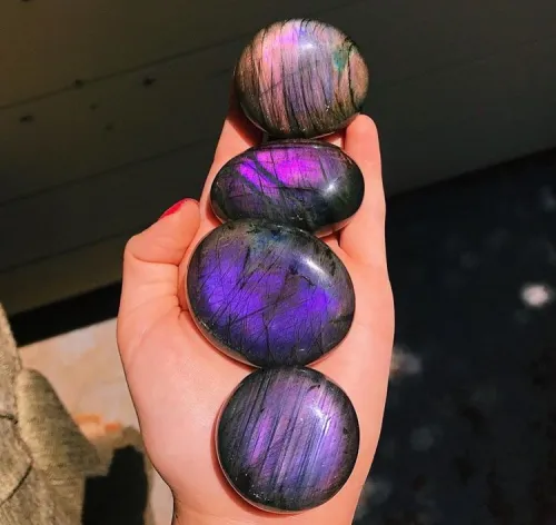 Styling labradorite ornaments on a holiday tree